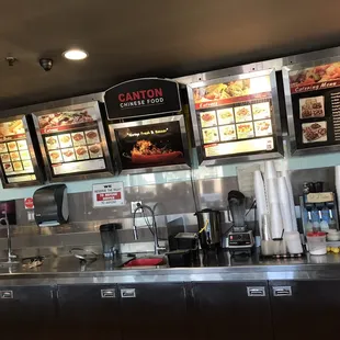 a woman standing in front of the counter