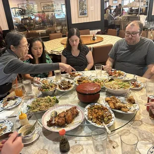 A delicious family-style Chinese variety of dishes on a large lazy susan