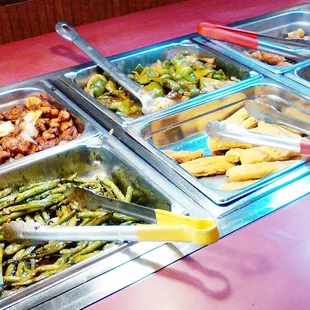 a buffet with a variety of food items