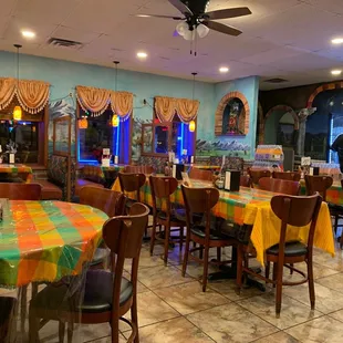 a restaurant with tables and chairs