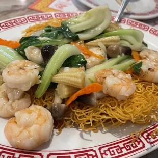 a plate of noodles and shrimp