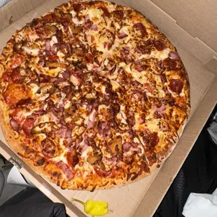 half meat lovers half Canton Hawaiian Pizza
