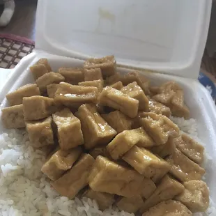 Orange tofu over rice yummmm