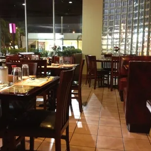 a restaurant with tables and chairs