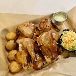 House Signature Rotisserie Chicken--Pollo Valenciano, Arepitas, Venezuelan Coleslaw, and Salsa Guasacaca