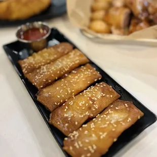 Croquetas de Camarones--Shrimp Egg Rolls accompanied with Salsa Agridulce
