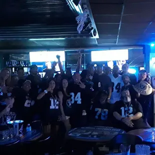 a large group of people posing for a picture