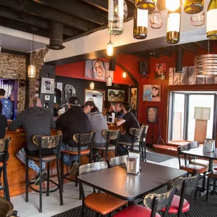a group of people sitting at a bar
