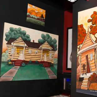 a painting of a house and a painting of a house