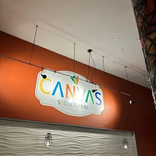 a sign hanging from the ceiling