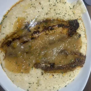 Blacked catfish over grits