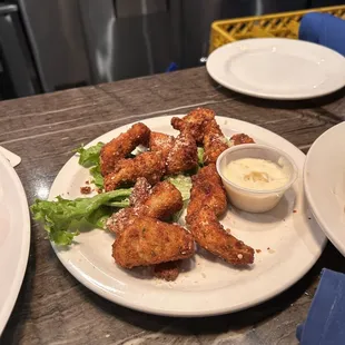 Fried Parmesan artichokes on the happy hour menu.