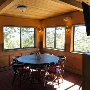 a dining room with a table and chairs