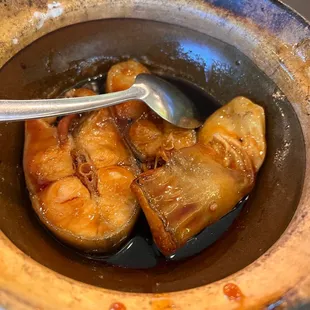 a bowl of food with a spoon in it