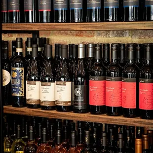 a shelf full of wine bottles