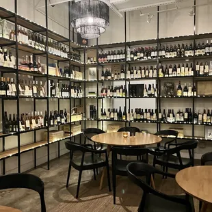 wine bottles on shelves and tables