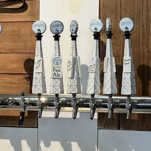 a row of beer taps