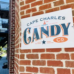 a sign on a brick building