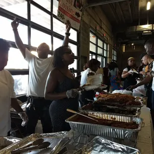 Waiting for delicious cuisine at the Jollof Festival.