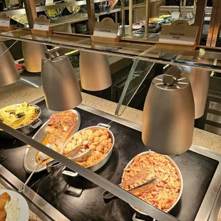 a variety of pizzas on display