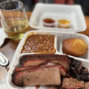 Brisket plate with baked beans &amp; cornbread...glass of Chardonnay too!