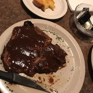 My steak with a lot of steak sauce