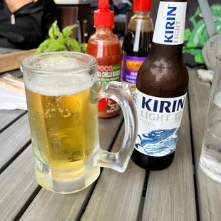 a glass of beer and a bottle of beer