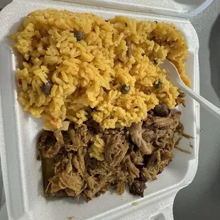 Arroz con gandules like abuela makes em and pernil so soft you ganna need a spoon to eat it
