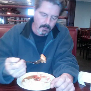 a man eating a plate of food