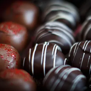 Truffles in perfect temper.  The shine is the natural chocolate - not waxy coatings you see in manufactured chocolates.