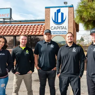 a group of people standing in front of a building