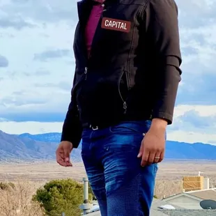 a man standing on a roof