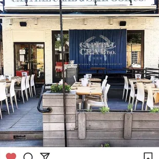 a photo of a restaurant with tables and chairs