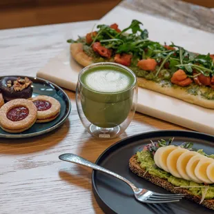 a plate of food and a glass of juice