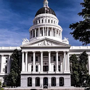 State capital building with one lone cop car nobody is in it