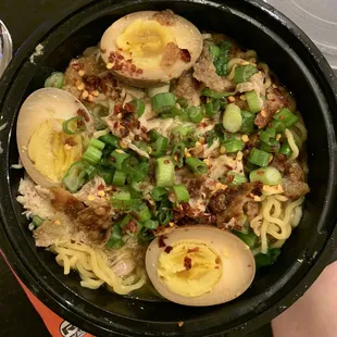 Chicken ramen (topped with cracklin, green onions, and red pepper flakes) with extra soy-mirin egg
