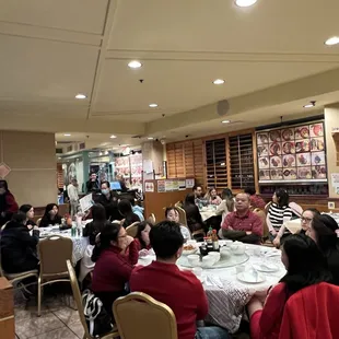 a large group of people sitting at tables