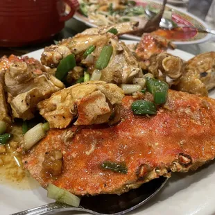 a plate of crab and vegetables