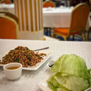 Minced duck with lettuce during Chinese New Year may symbolize prosperity, unity, and good fortune
