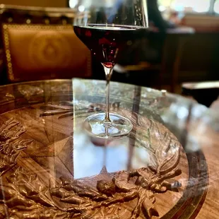 a glass of wine on a table