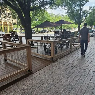 a man walking down the sidewalk
