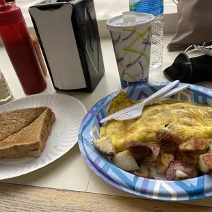 Spinach, feta, and mushroom omelette with toast and a coffee