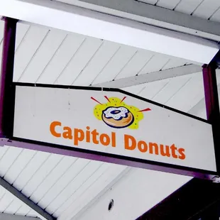 a sign for a donut shop