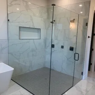 Frameless shower glass enclosure