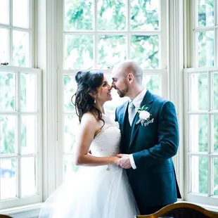 By this GORGEOUS window!  © Carol Solorzano - Wedding Photographer - www.dcorzo.com