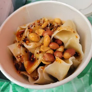 Spicy dumpling bowl with added peanuts on top from Cute Dumplings stall