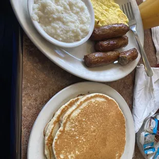 Grits, pancakes, sausage, eggs