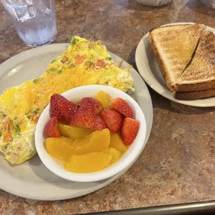 Garden Omelette with toast and fruit. This omelette gets 5 stars for sure. Very delicious and great portion size.