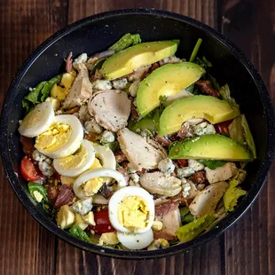 Cobb Salad
egg, avocados, bacon , grilled chicken, ,tomatoes, bleu cheese, on a bed of romaine and spinach
