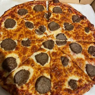 Large pizza with meatballs